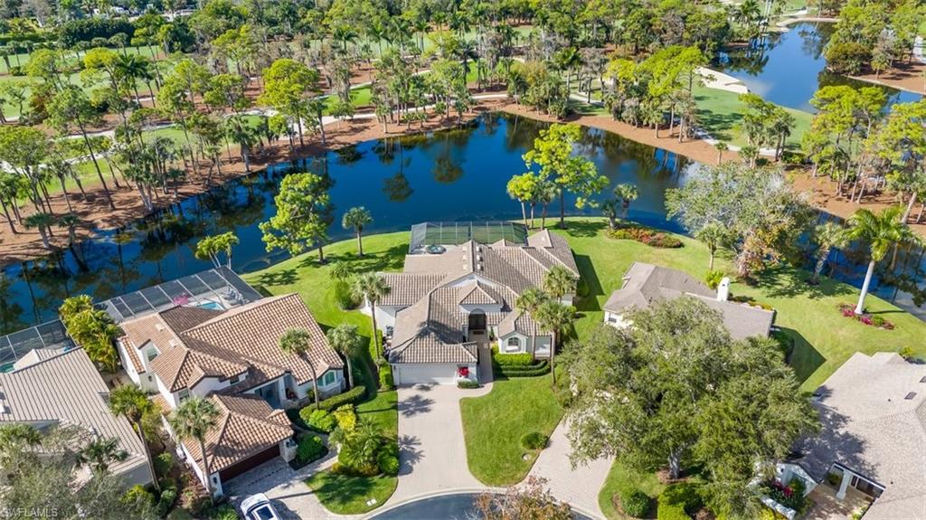 25 Grey Wing Point Naples, FL 34113 - Photo 4 of 25 an aerial view of residential house with outdoor space and swimming pool