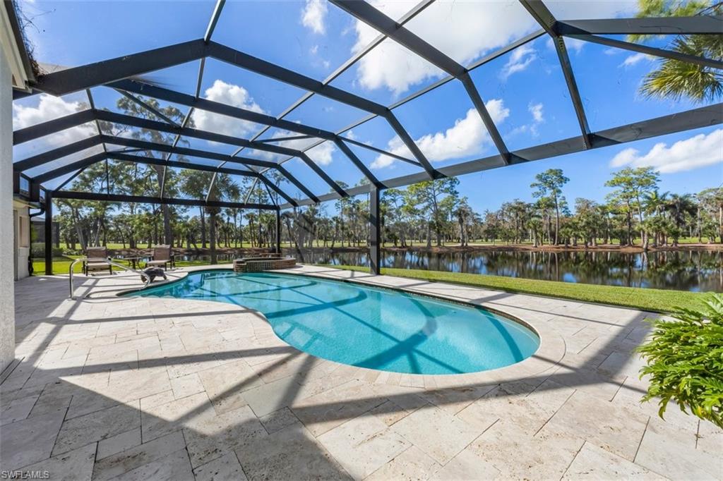 25 Grey Wing Point Naples, FL 34113 - Photo 6 of 25 a view of a swimming pool with a patio