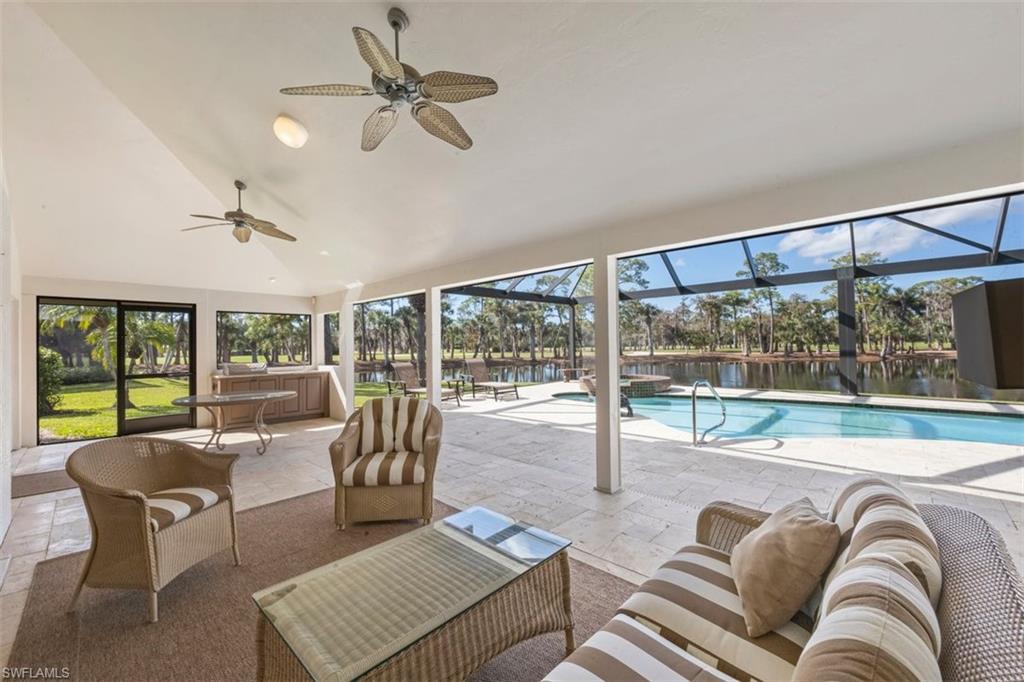 25 Grey Wing Point Naples, FL 34113 - Photo 7 of 25 a living room with furniture and floor to ceiling windows