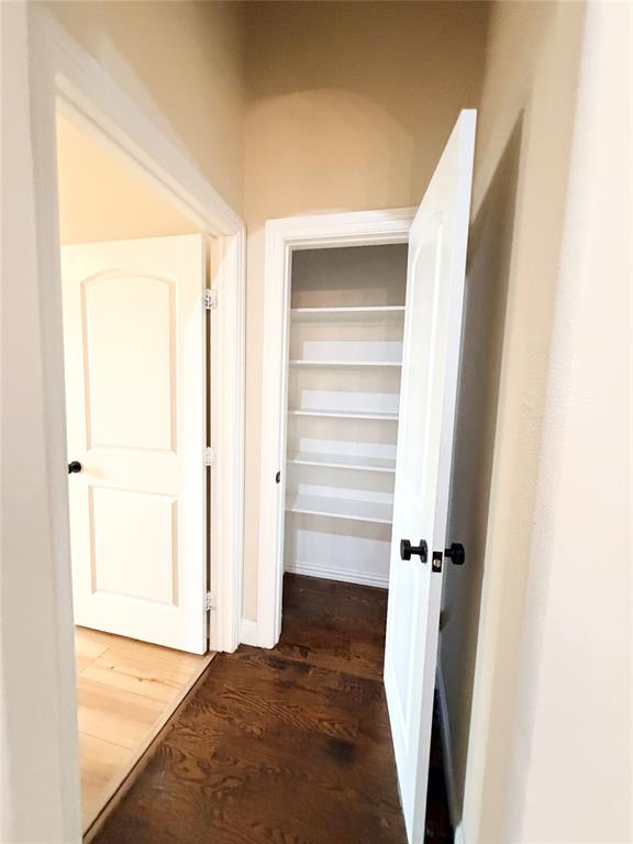 501 Elwood Road Irving, TX 75061 - Photo 18 of 30 a view of walk in closet with empty racks