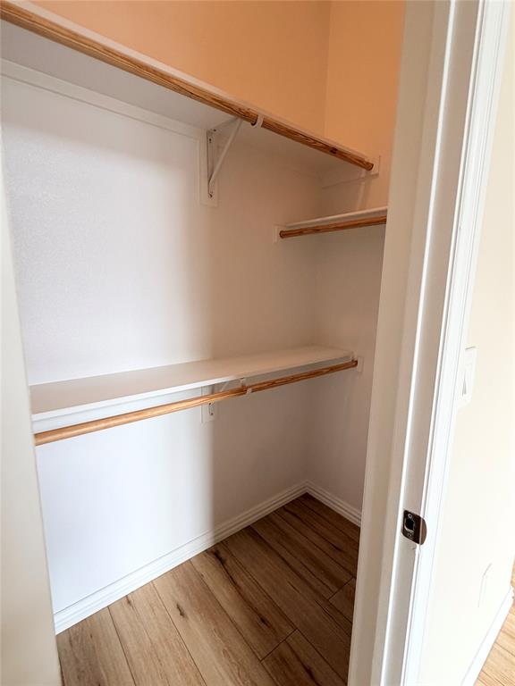501 Elwood Road Irving, TX 75061 - Photo 21 of 30 a view of an empty walk in closet