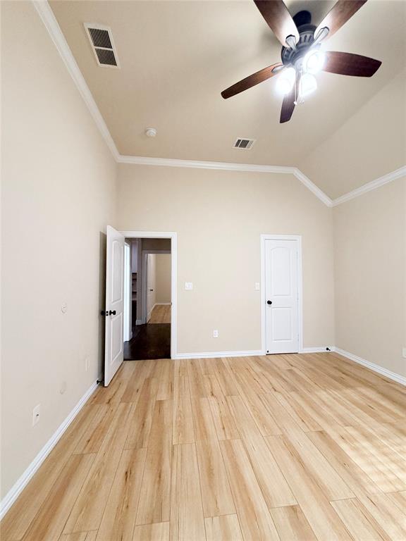 501 Elwood Road Irving, TX 75061 - Photo 23 of 30 a bedroom with a bed and a ceiling fan