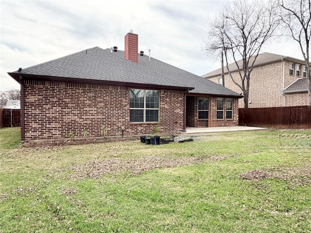 501 Elwood Road Irving, TX 75061 - Photo 27 of 30 a front view of a house with garden