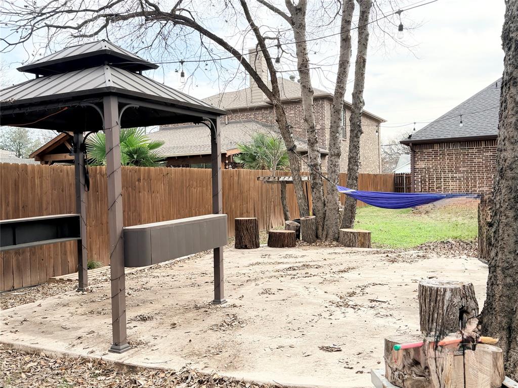 501 Elwood Road Irving, TX 75061 - Photo 29 of 30 a view of a house with a snow on a yard