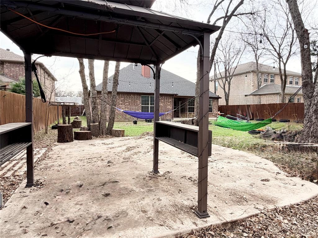 501 Elwood Road Irving, TX 75061 - Photo 30 of 30 a view of a outdoor space with a patio and backyard