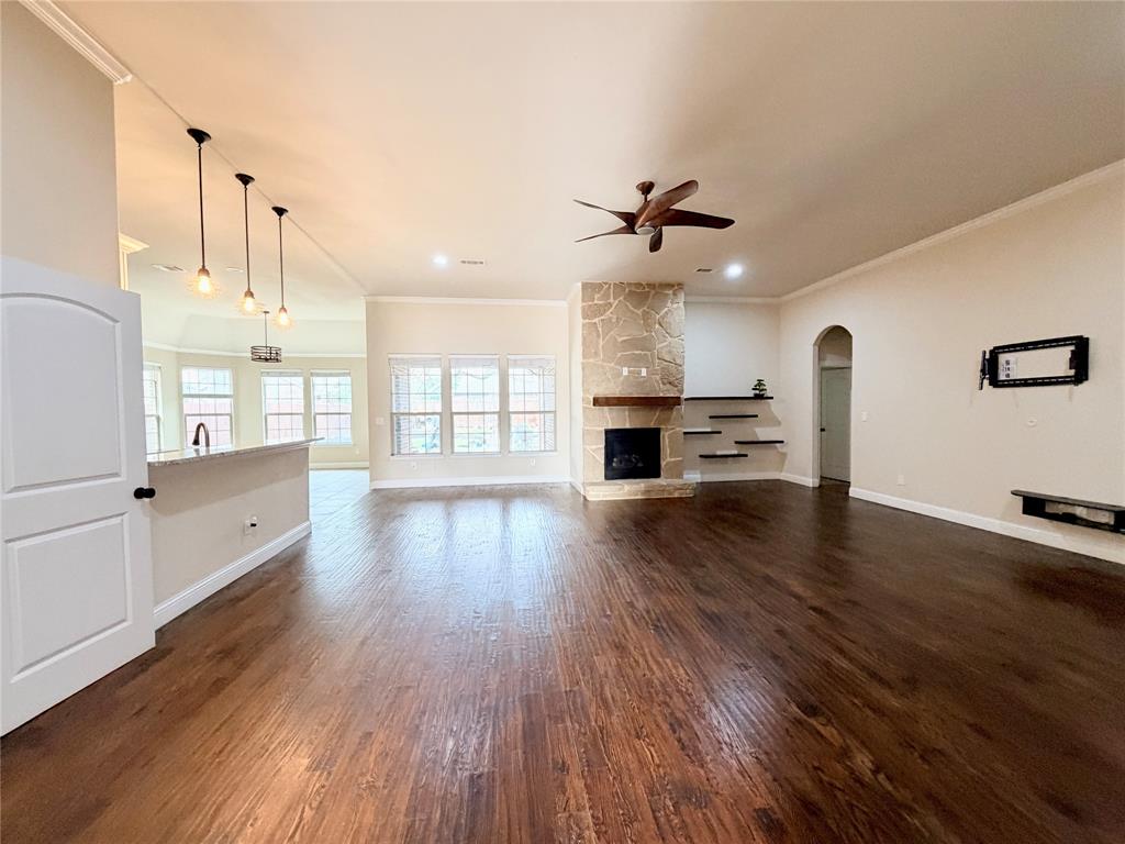 501 Elwood Road Irving, TX 75061 - Photo 3 of 30 a view of a kitchen with furniture and wooden floor