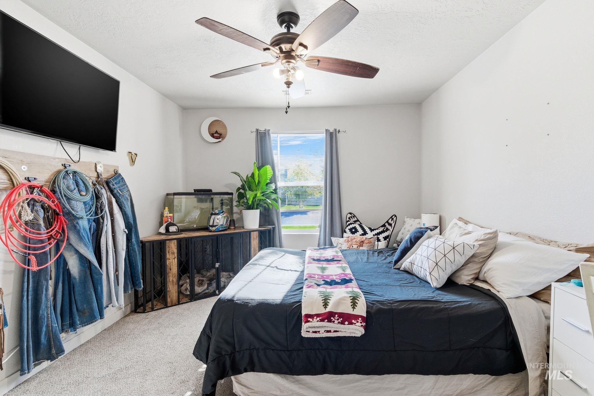 16887 Bethany Avenue Caldwell, ID 83607 - Photo 29 of 50 Interior room featuring textured carpeting and light-colored walls