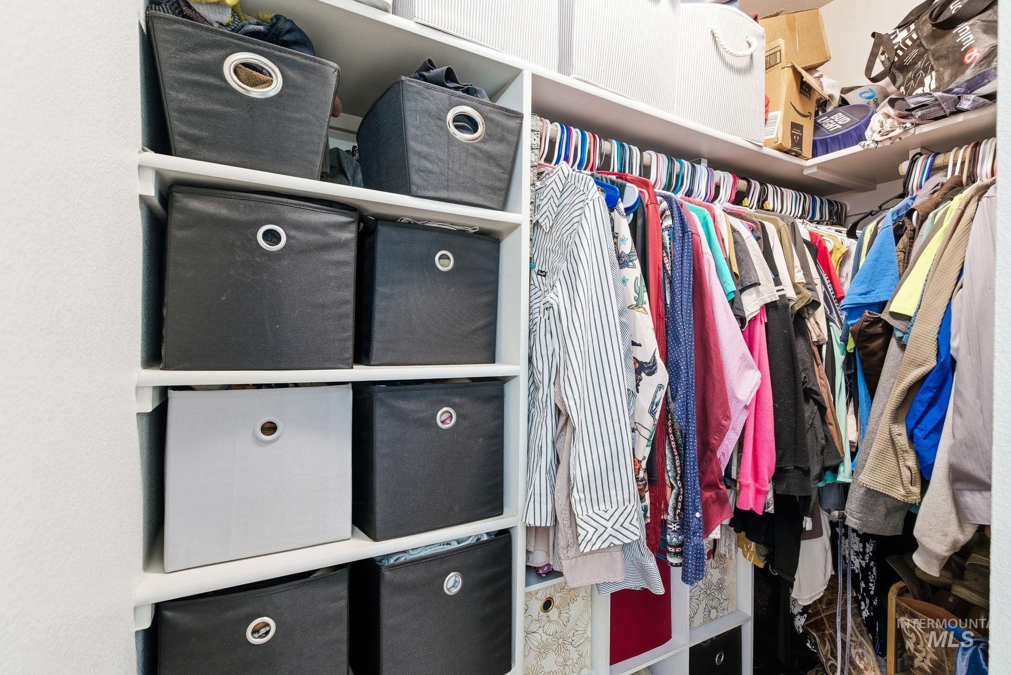 16887 Bethany Avenue Caldwell, ID 83607 - Photo 31 of 50 Walk-in closet featuring white shelving units and multiple clothing rods