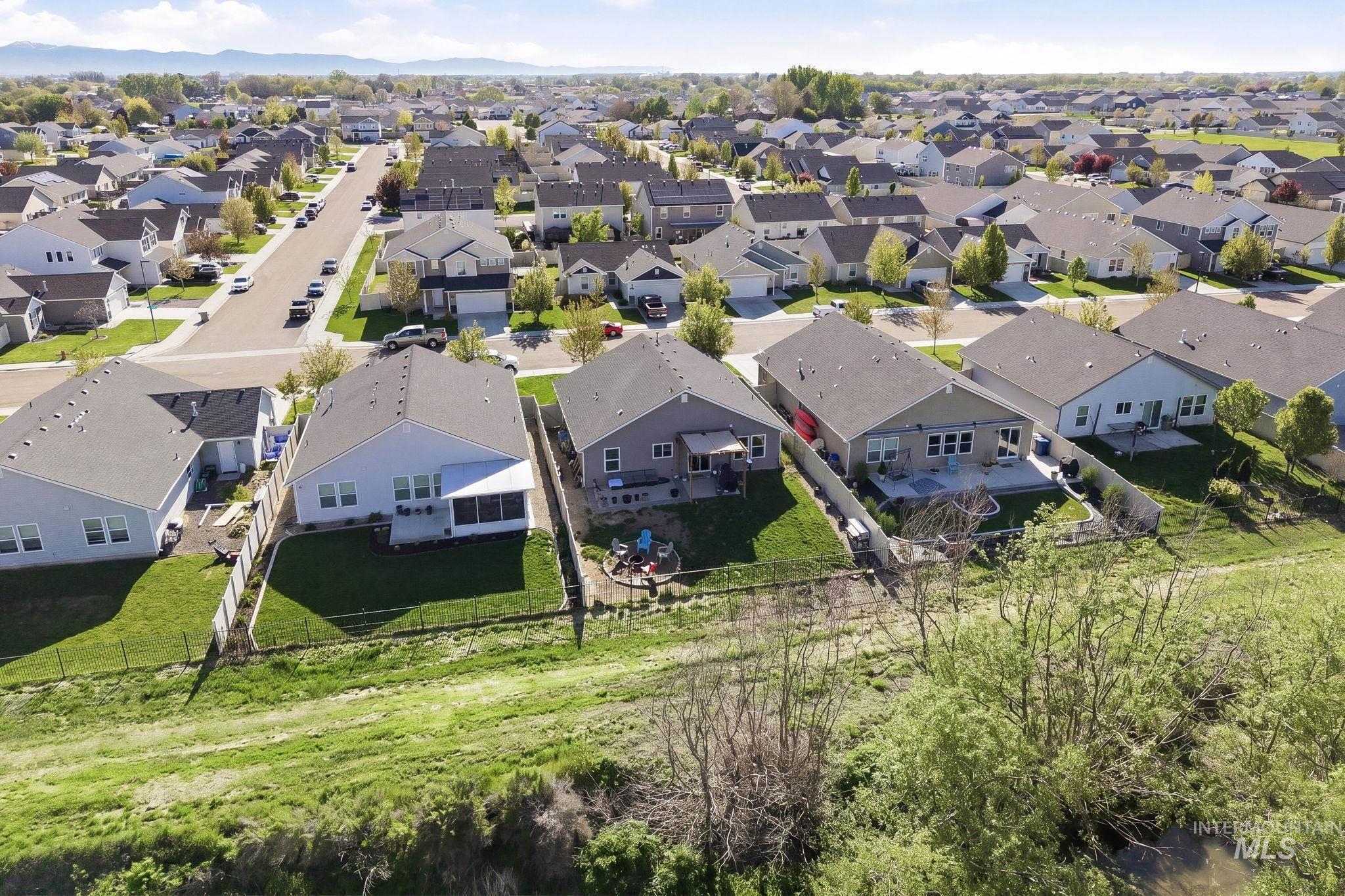 16887 Bethany Avenue Caldwell, ID 83607 - Photo 47 of 50 Aerial perspective showcasing residential properties with light-colored siding and dark shingle roofs