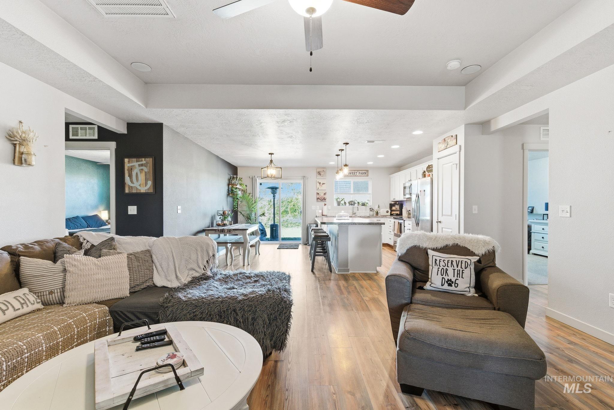 16887 Bethany Avenue Caldwell, ID 83607 - Photo 6 of 50 Open-concept living area featuring wood-finish flooring, recessed lighting, and a ceiling fan