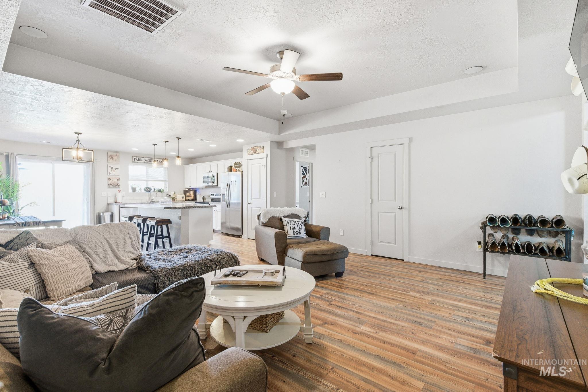 16887 Bethany Avenue Caldwell, ID 83607 - Photo 7 of 50 Open-concept living space featuring wood-finish flooring, recessed lighting, and a ceiling fan