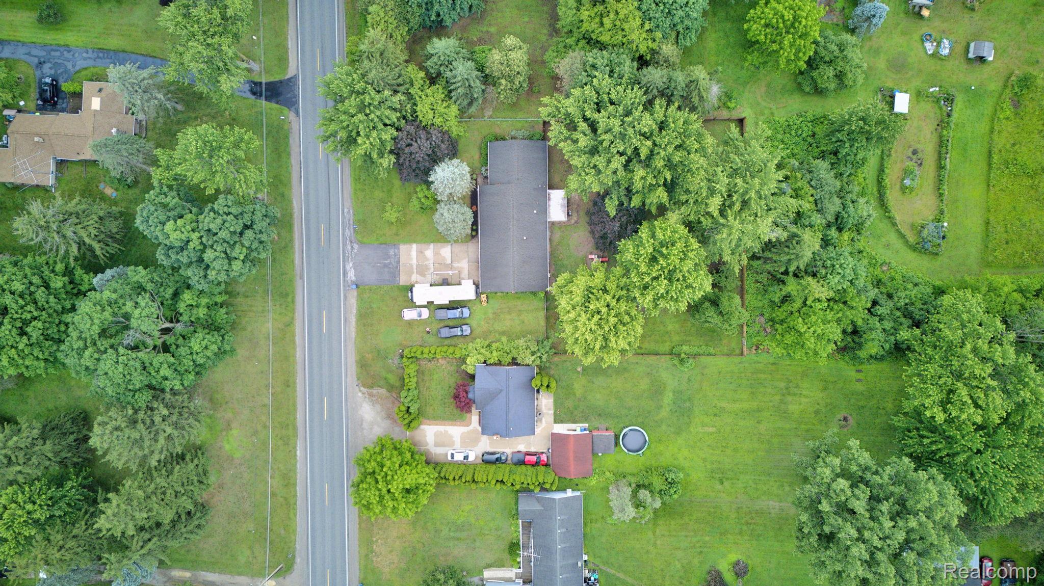 5330 Sheridan Road Saginaw, MI 48601 - Photo 48 of 50 Aerial perspective showcasing a residential property with extensive green space