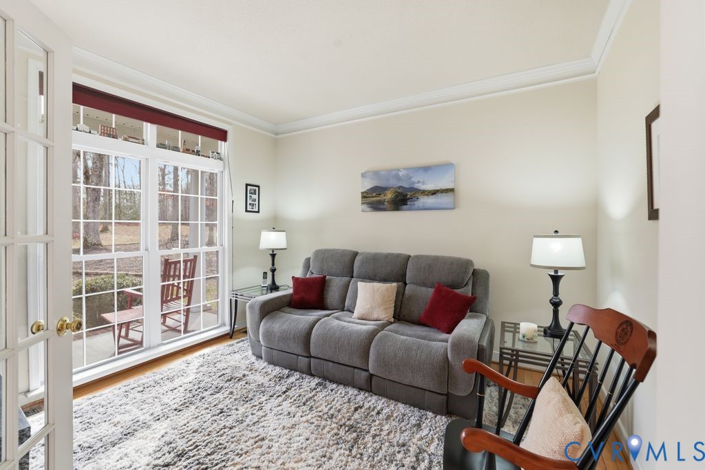 13630 River Road Chesterfield, VA 23838 - Photo 12 of 57 a living room with furniture and a floor to ceiling window