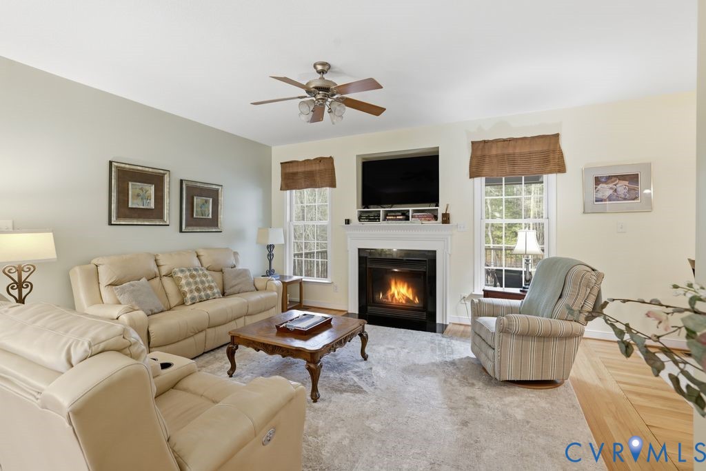 13630 River Road Chesterfield, VA 23838 - Photo 14 of 57 a living room with furniture a flat screen tv and a fireplace