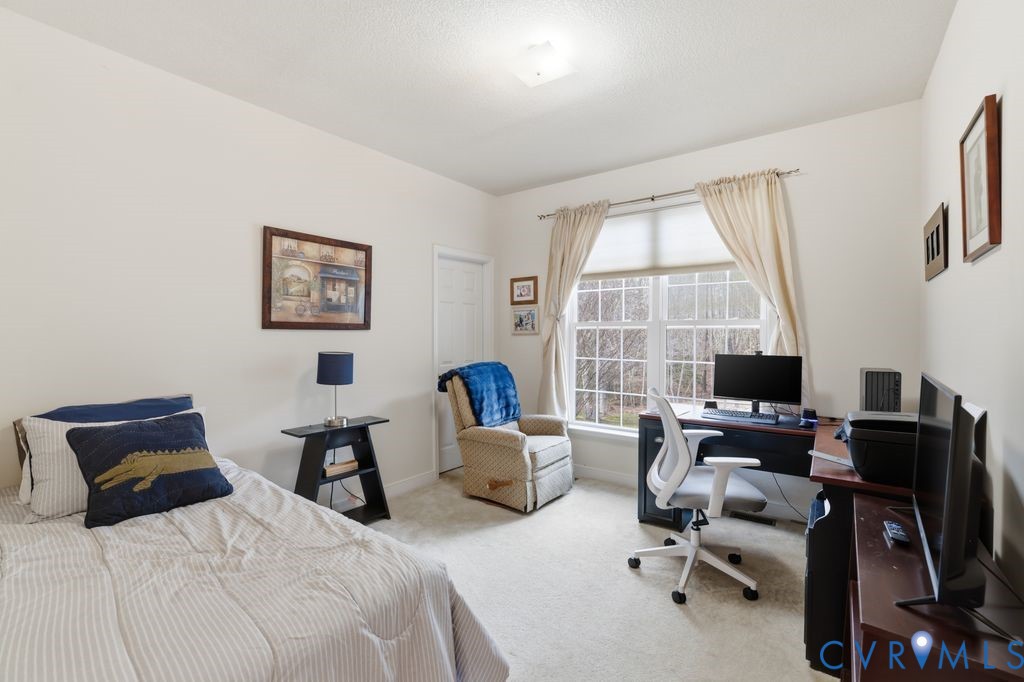 13630 River Road Chesterfield, VA 23838 - Photo 16 of 57 a bedroom with two beds and a large window