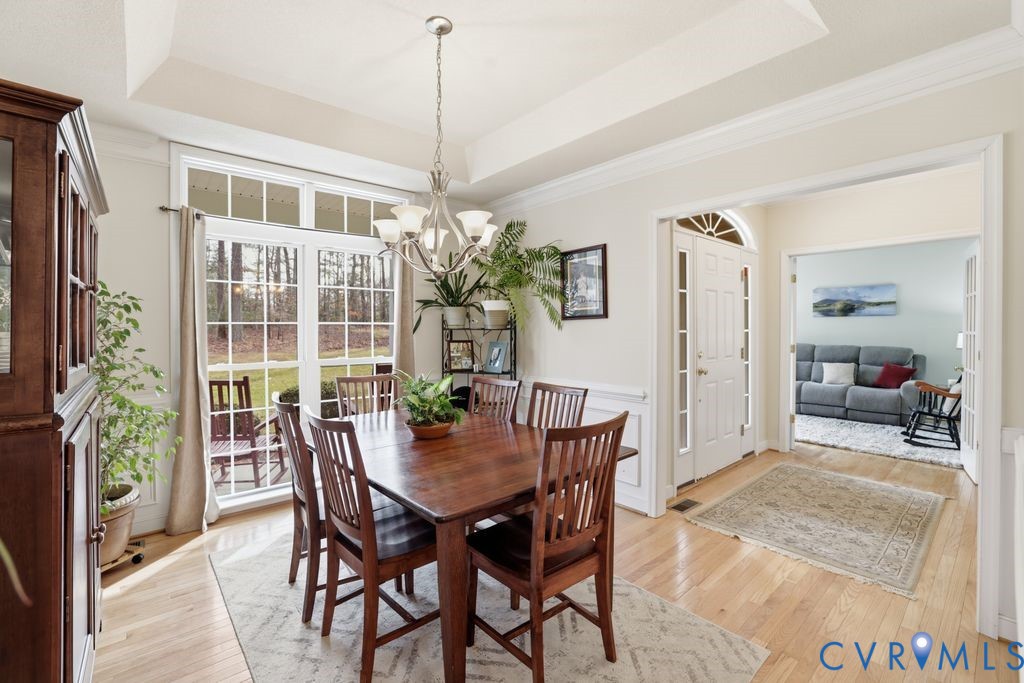 13630 River Road Chesterfield, VA 23838 - Photo 19 of 57 a view of a dining room with furniture window and wooden floor