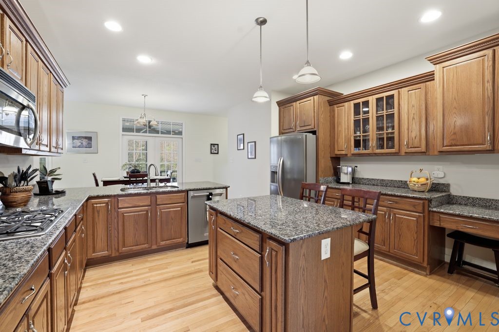 13630 River Road Chesterfield, VA 23838 - Photo 20 of 57 a kitchen with stainless steel appliances granite countertop a sink stove and refrigerator