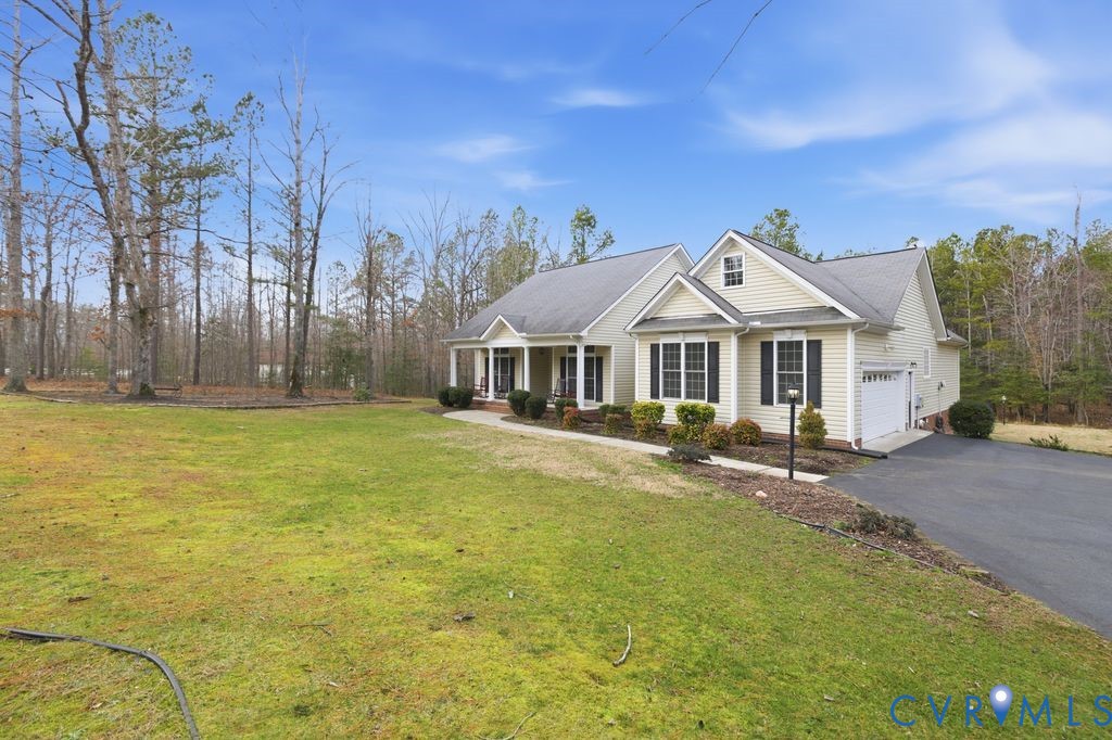 13630 River Road Chesterfield, VA 23838 - Photo 2 of 57 a front view of house with yard and trees in the background