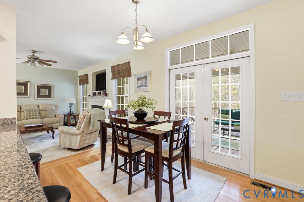13630 River Road Chesterfield, VA 23838 - Photo 25 of 57 a view of a dining room with furniture window and wooden floor