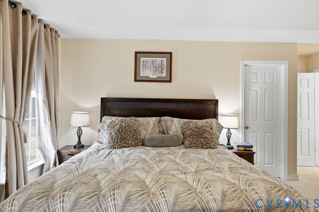 13630 River Road Chesterfield, VA 23838 - Photo 27 of 57 a bedroom with a bed and a window