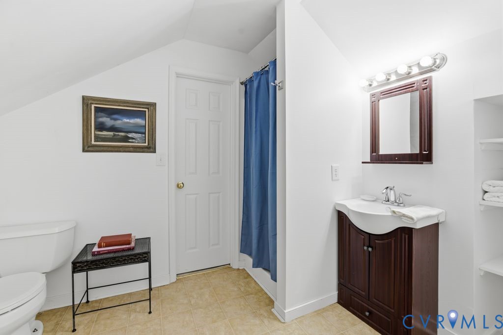 13630 River Road Chesterfield, VA 23838 - Photo 36 of 57 a bathroom with a sink and a mirror