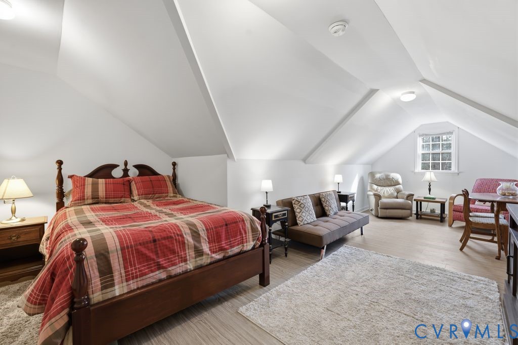 13630 River Road Chesterfield, VA 23838 - Photo 37 of 57 a bedroom with bed and a couch