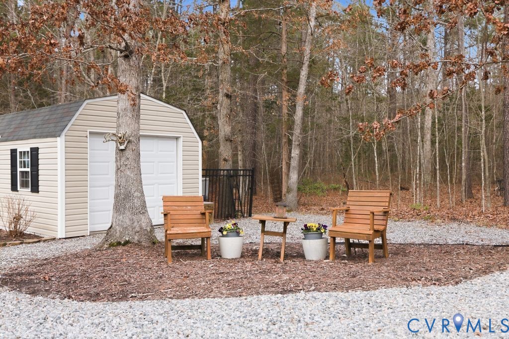 13630 River Road Chesterfield, VA 23838 - Photo 42 of 57 a backyard of a house with outdoor seating