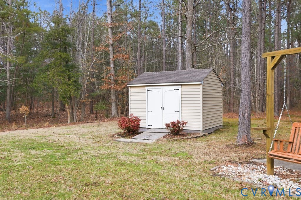 13630 River Road Chesterfield, VA 23838 - Photo 44 of 57 a backyard of a house with table and chairs