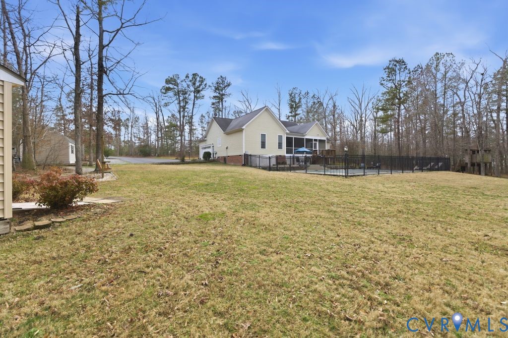 13630 River Road Chesterfield, VA 23838 - Photo 46 of 57 a view of a large pool with a yard
