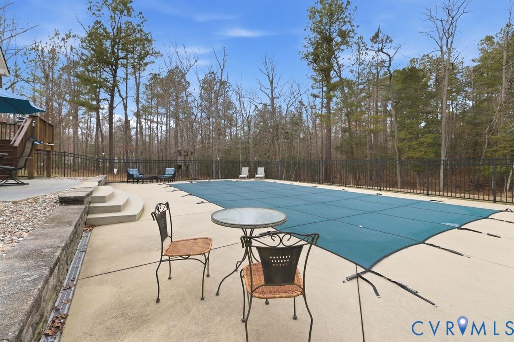 13630 River Road Chesterfield, VA 23838 - Photo 48 of 57 a swimming pool with outdoor seating and yard