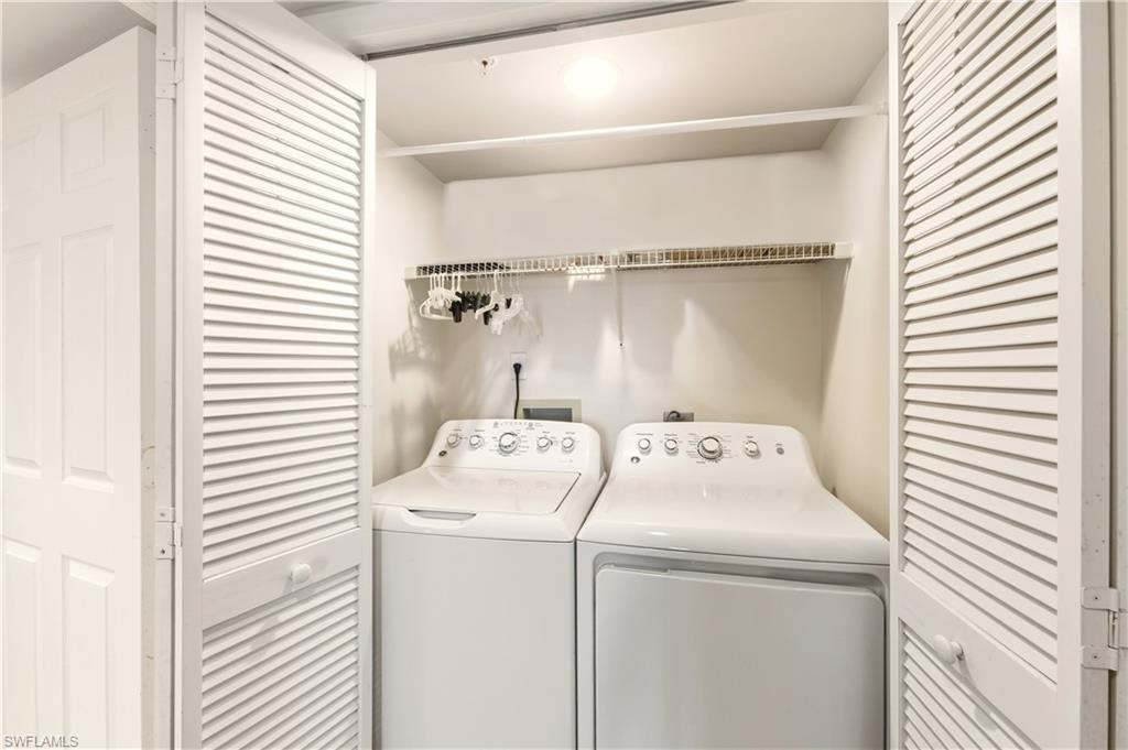 21 Bluebill Avenue, Unit 403B Naples, FL 34108 - Photo 25 of 37 a utility room with dryer and washer