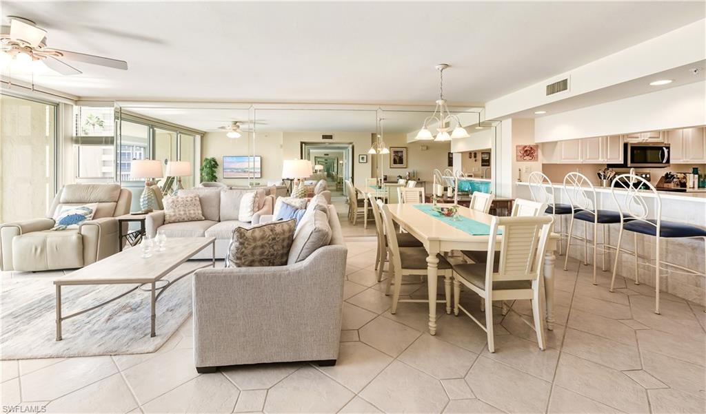 21 Bluebill Avenue, Unit 403B Naples, FL 34108 - Photo 10 of 37 a view of a dining room with furniture