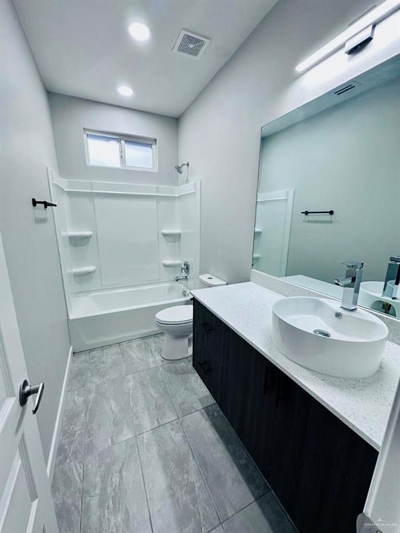 3800 Robin Street, Unit 2 Pharr, TX 78577 - Photo 11 of 18 a bathroom with a sink a toilet and shower