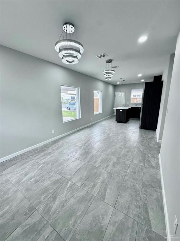 3800 Robin Street, Unit 2 Pharr, TX 78577 - Photo 18 of 18 an empty room with windows and ceiling fan