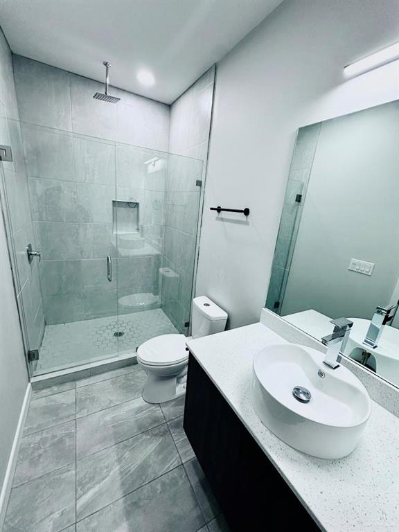 3800 Robin Street, Unit 2 Pharr, TX 78577 - Photo 7 of 18 a bathroom with a sink a toilet and shower
