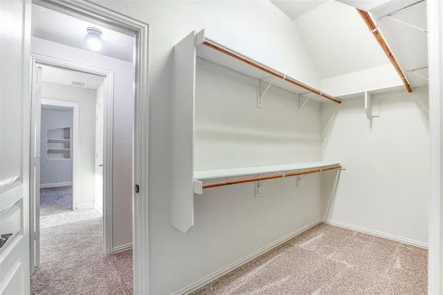 a view of an empty walk in closet