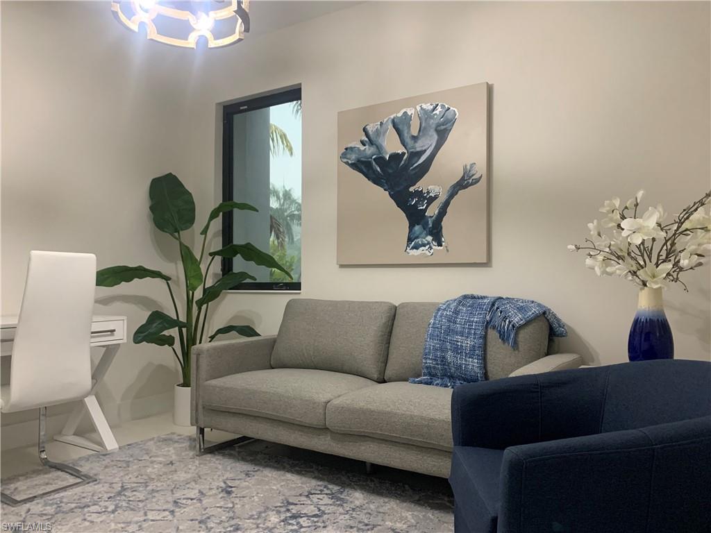 214 Legacy Court Naples, FL 34110 - Photo 12 of 49 The DEN located off the Great Room and Kitchen, is great room for kids to do homework or watch their own TV program.