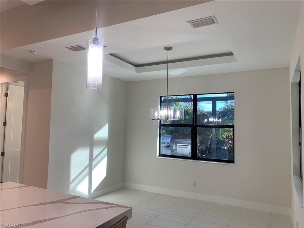 214 Legacy Court Naples, FL 34110 - Photo 15 of 49 Dining Area immediately off kitchen.