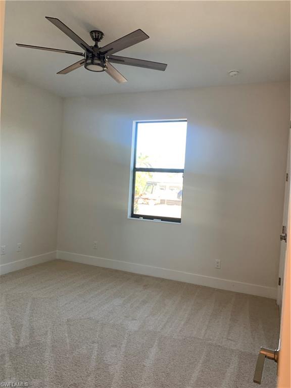 214 Legacy Court Naples, FL 34110 - Photo 38 of 49 an empty room with a window