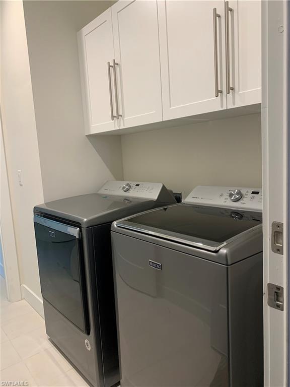 214 Legacy Court Naples, FL 34110 - Photo 40 of 49 a utility room with dryer and washer