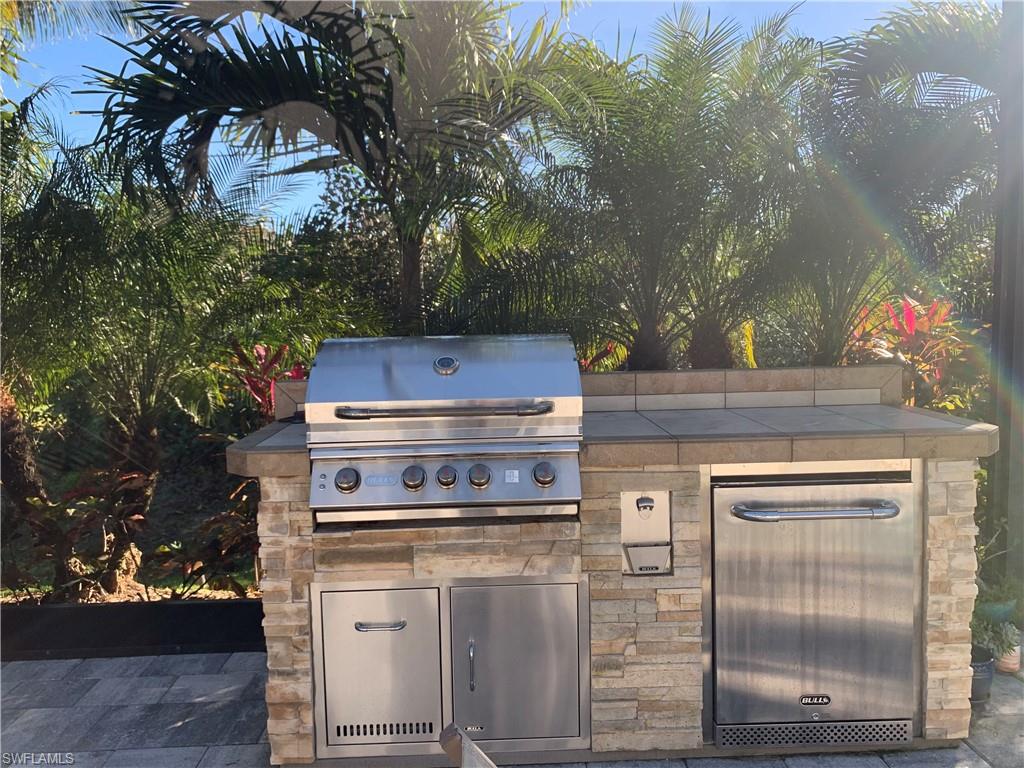 214 Legacy Court Naples, FL 34110 - Photo 44 of 49 a close view of a stove top oven