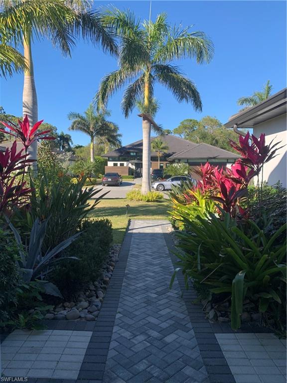 214 Legacy Court Naples, FL 34110 - Photo 45 of 49 a view of a yard with plants