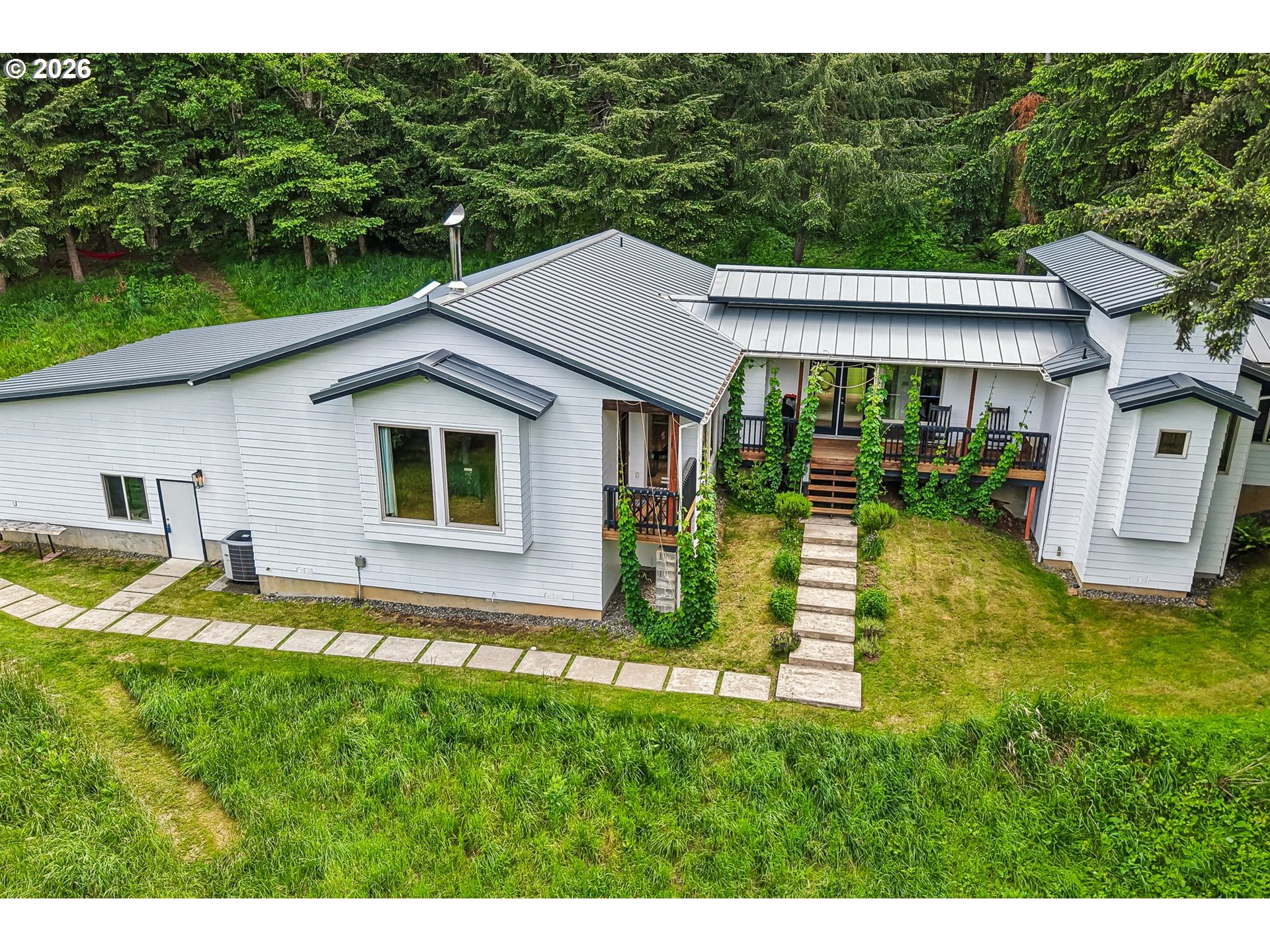 873 Mountain View Road Kalama, WA 98625 - Photo 2 of 45 a house view with a garden space