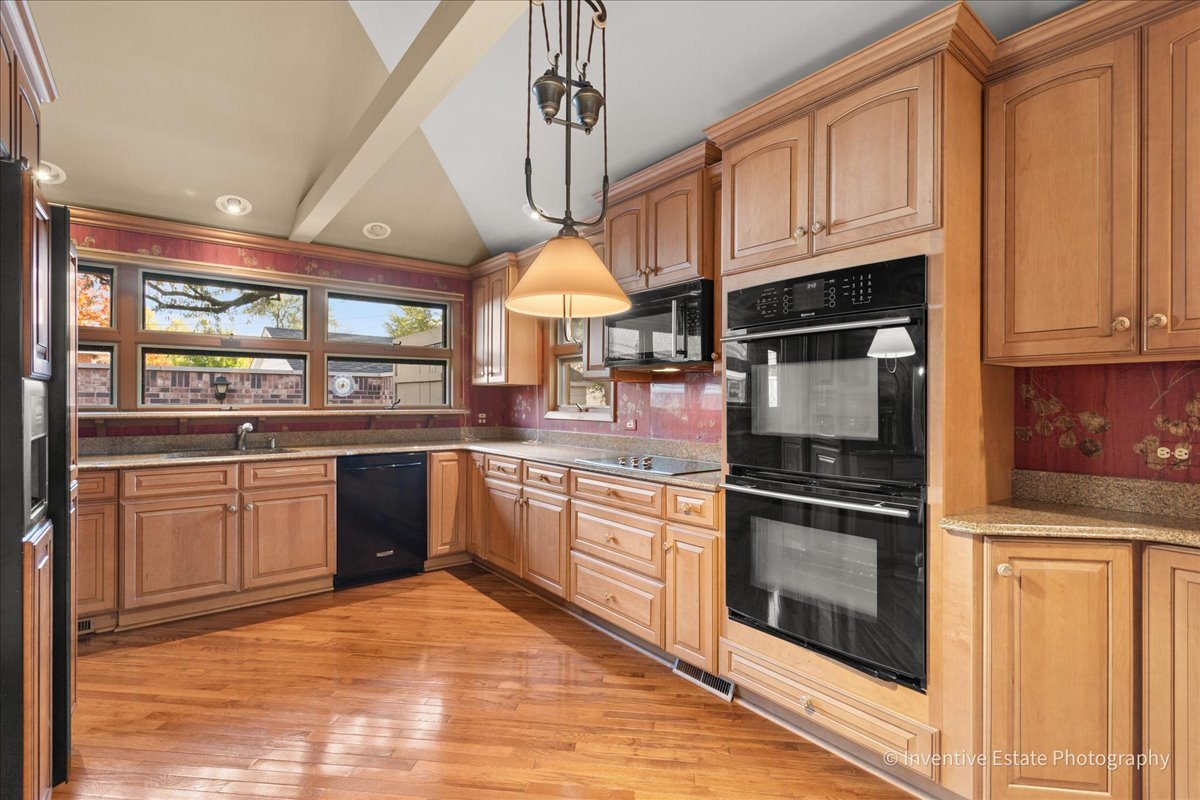 814 Saylor Avenue Elmhurst, IL 60126 - Photo 11 of 35 a kitchen with stainless steel appliances granite countertop a stove and cabinets