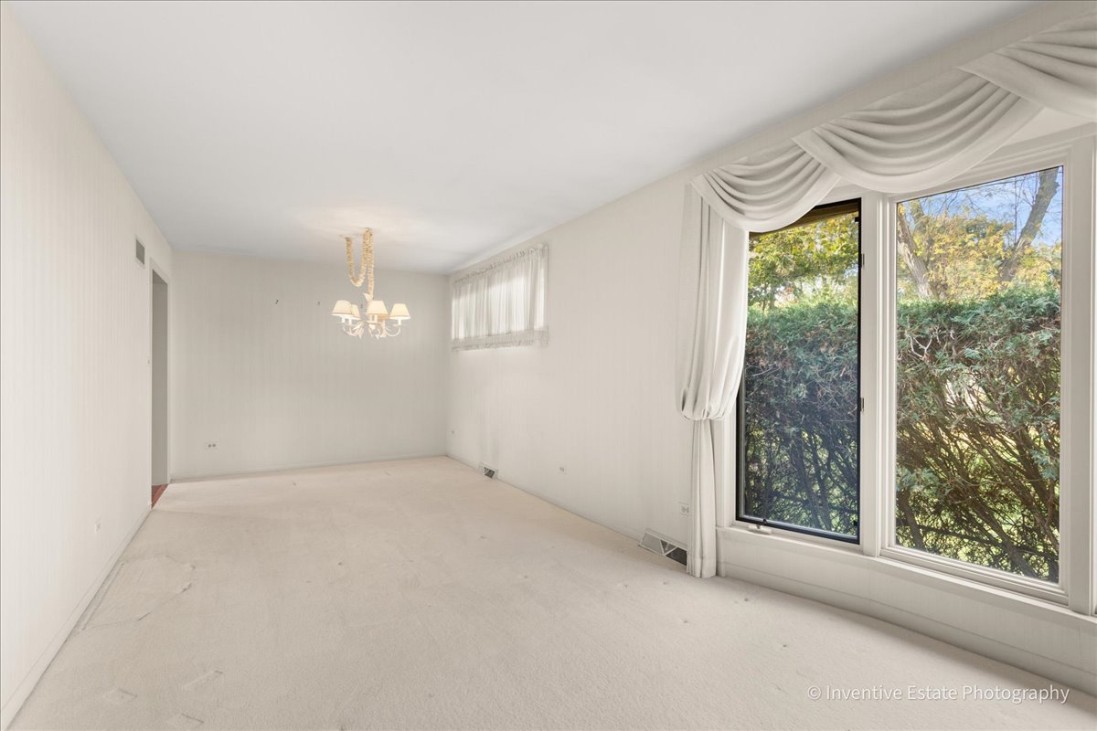 814 Saylor Avenue Elmhurst, IL 60126 - Photo 6 of 35 a view of an empty room with a window