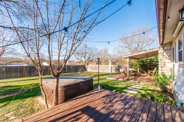 a view of a backyard with sitting area