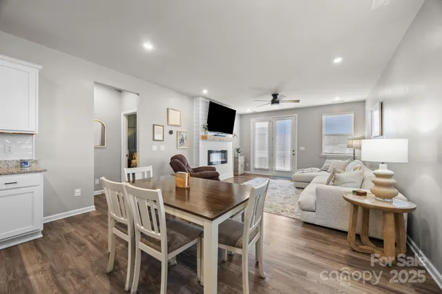 a living room with furniture fireplace and a flat screen tv