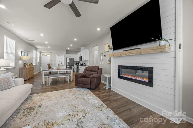 a bedroom with a bed and a refrigerator