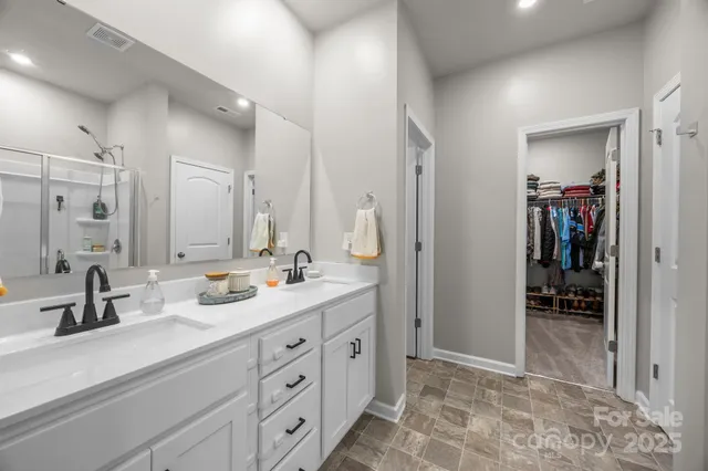 a bedroom with a bed and a mirror