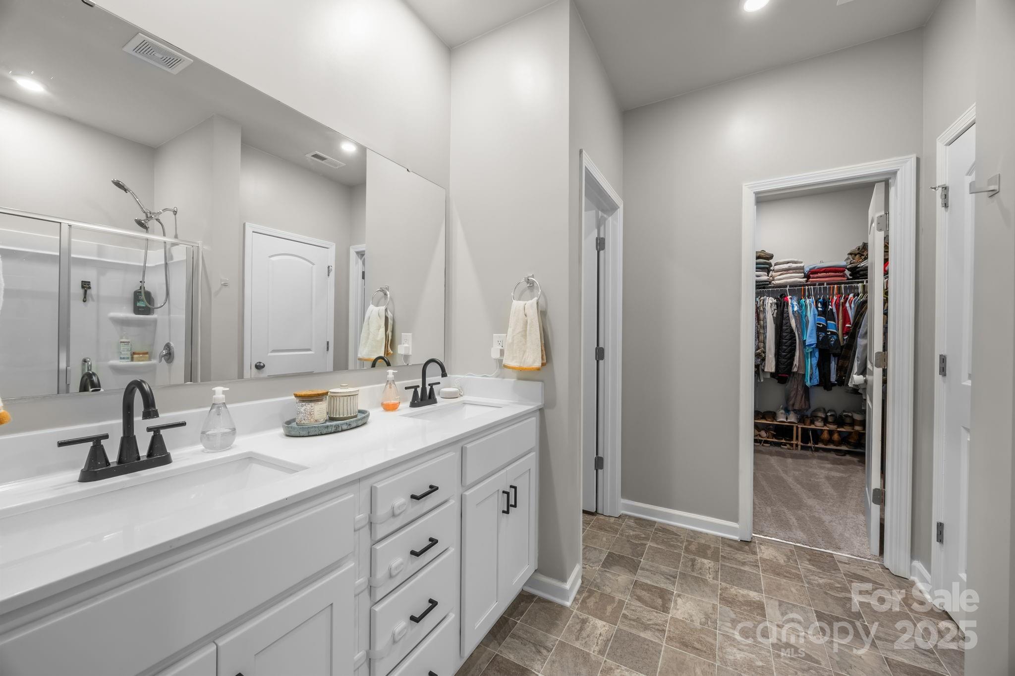 567 Sitka Drive York, SC 29745 - Photo 19 of 40 a spacious bathroom with double sink and a mirror